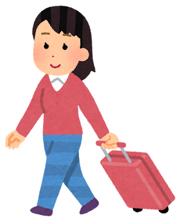 キャリーケースを引く女性